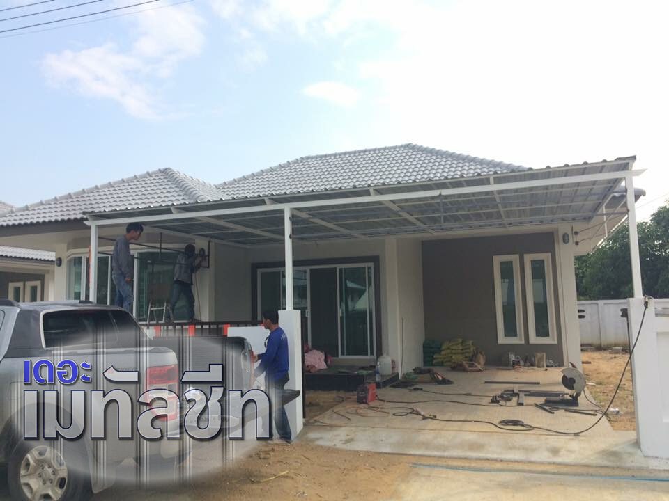 Designer carport with steel frame and metal sheet roof